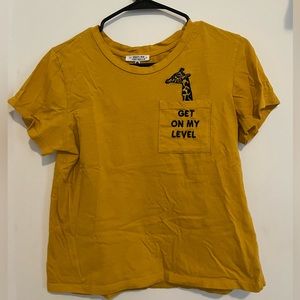 Marshall’s mustard yellow T shirt.